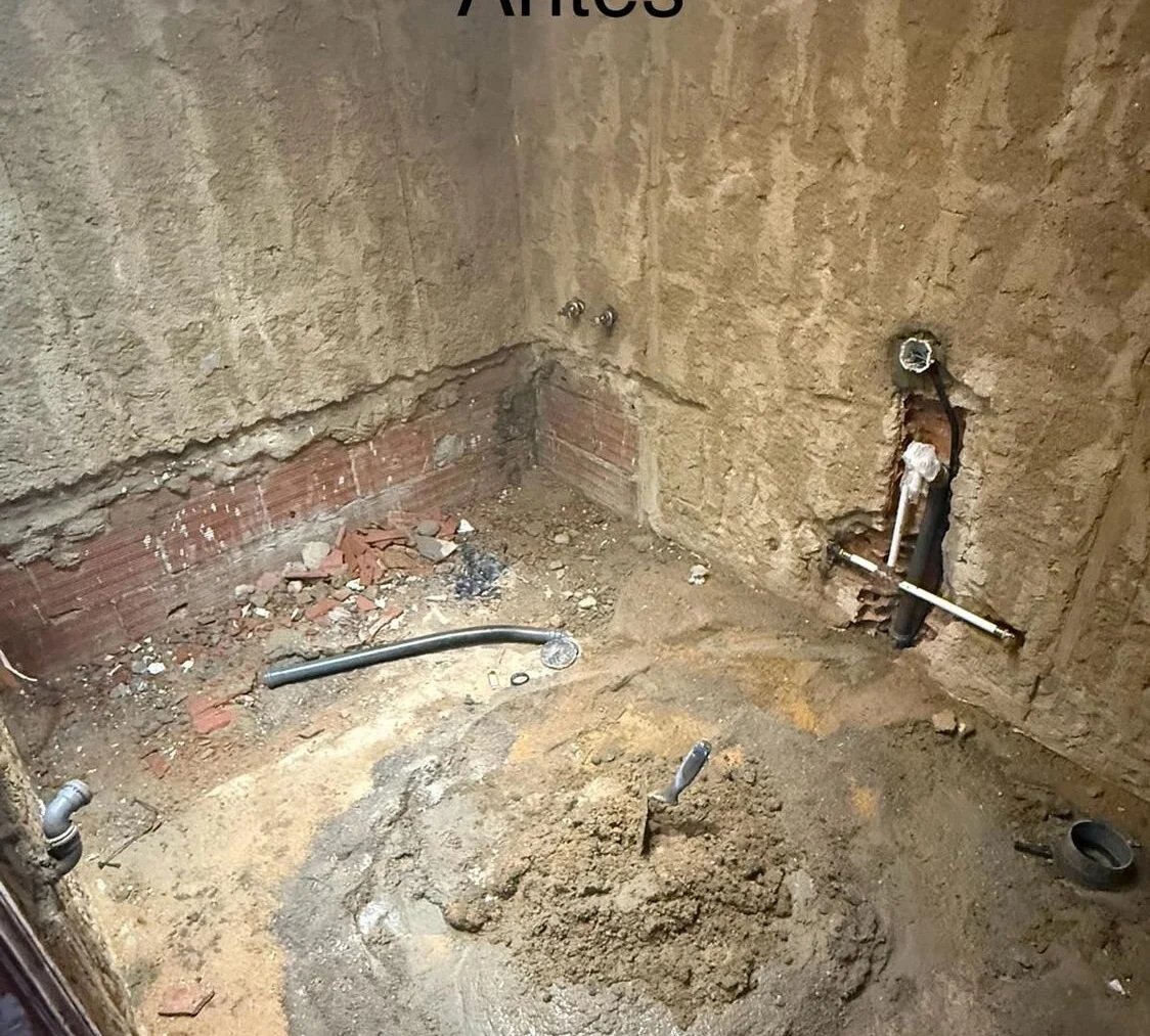 Before — bathroom stripped out for new pipework and finishes