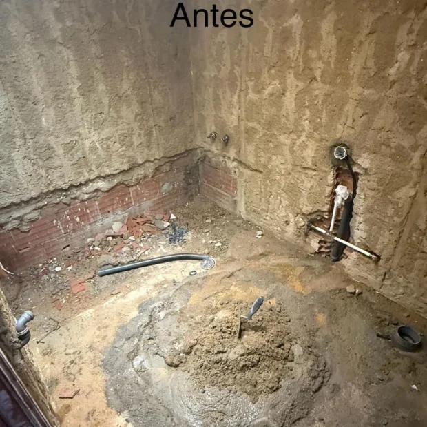 Before — bathroom stripped out for new pipework and finishes
