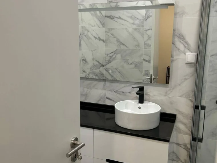 Marble bathroom with a wall-hung unit and a stone top