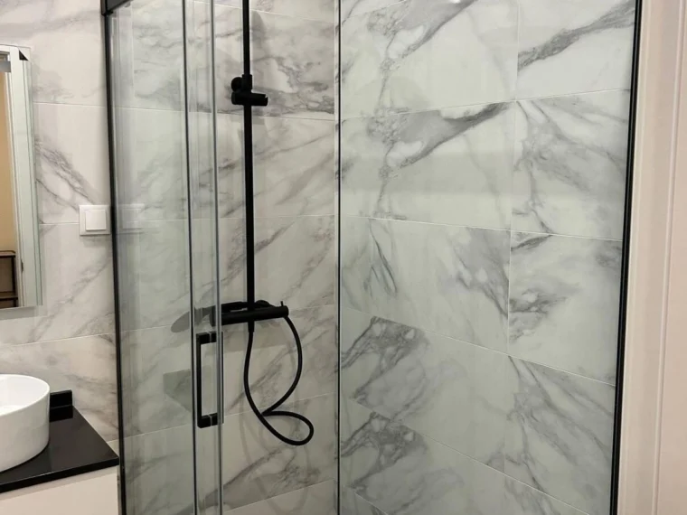 Marble shower tray with a glass screen