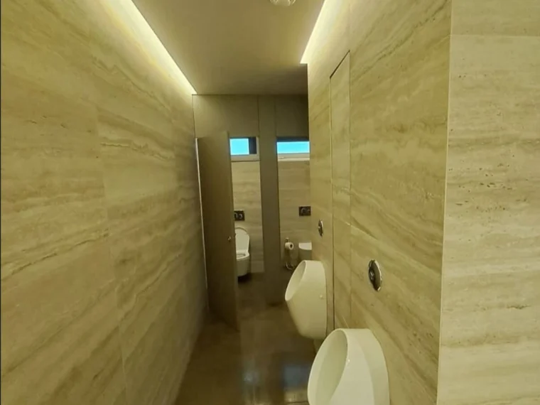 Corridor to the washrooms, travertine lining