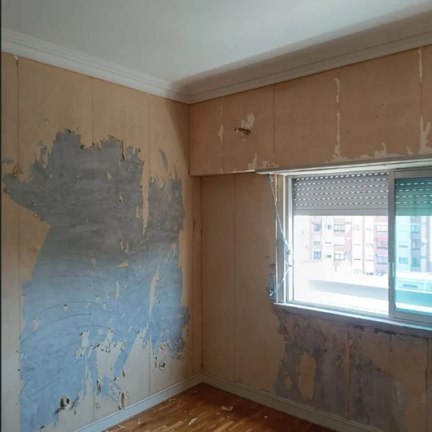 Before — the flat before the works, with the finishes past saving