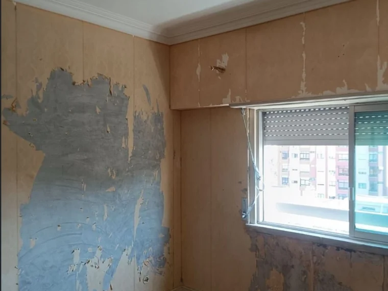 Before — the flat before the works, with the finishes past saving