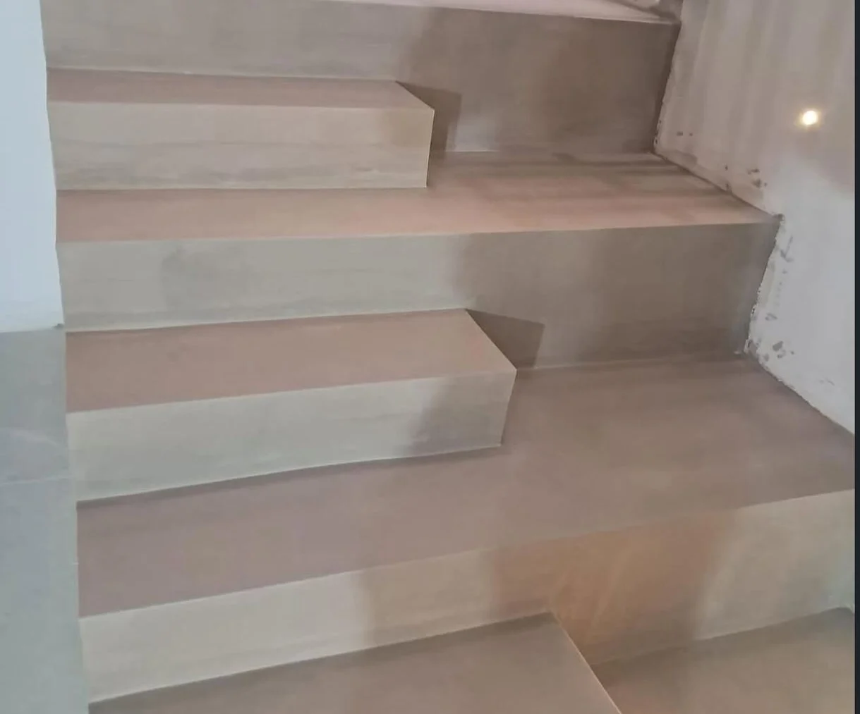 After — the same stair clad in stone