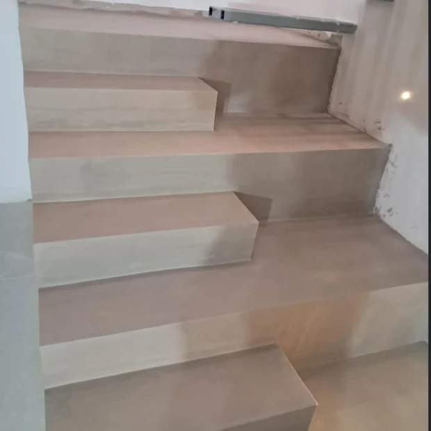After — the same stair clad in stone
