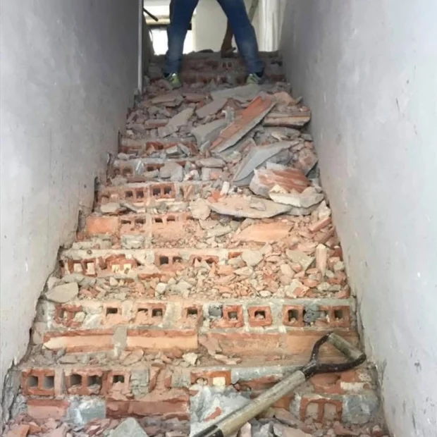 Before — stair stripped back to the masonry