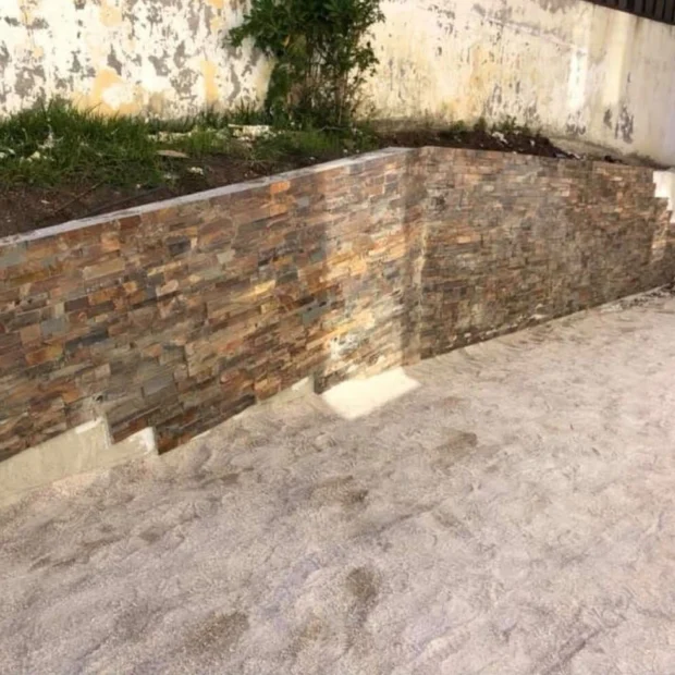 After — wall clad in stone