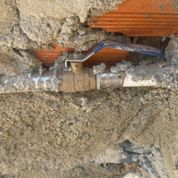 Pipework set into a masonry wall