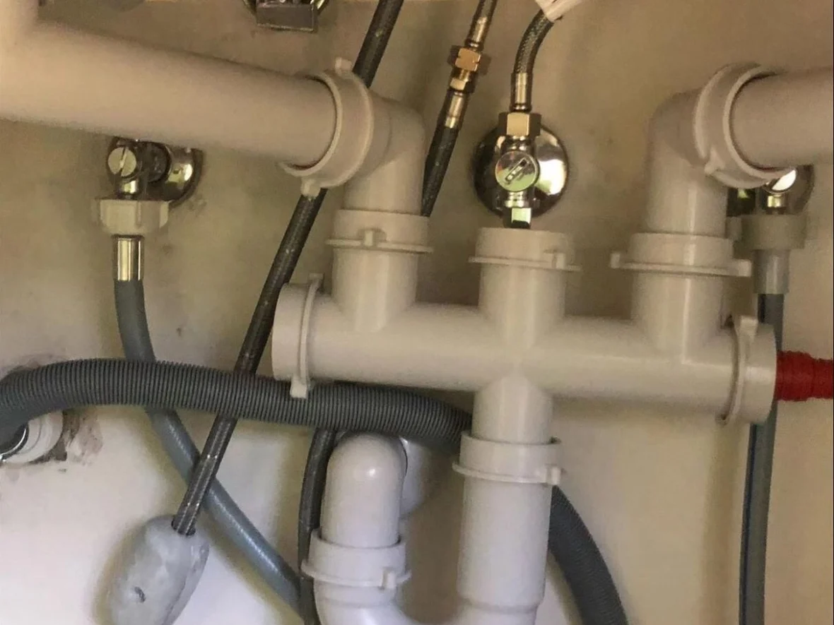Detail of a water and waste connection