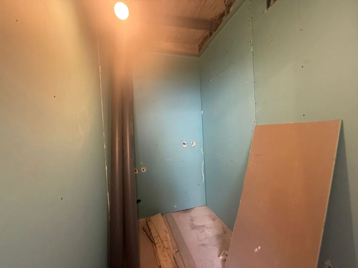 Partition in moisture-resistant board, wet area