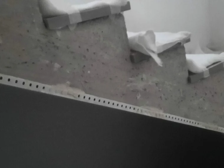 Applying dark microcement to a flight of stairs