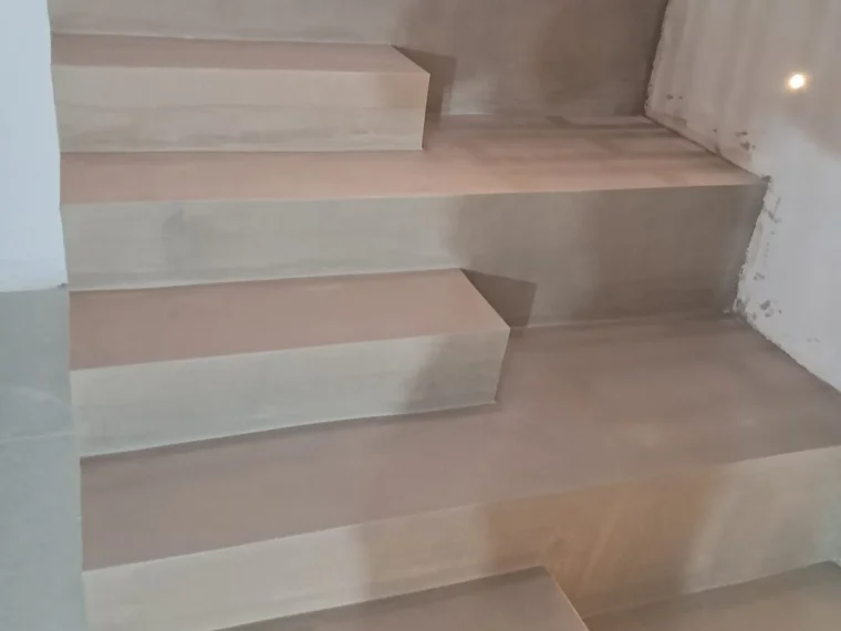 Stair in pale microcement, final coat
