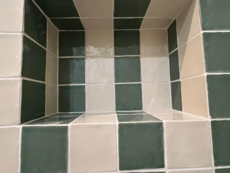 Niche lined in striped tile
