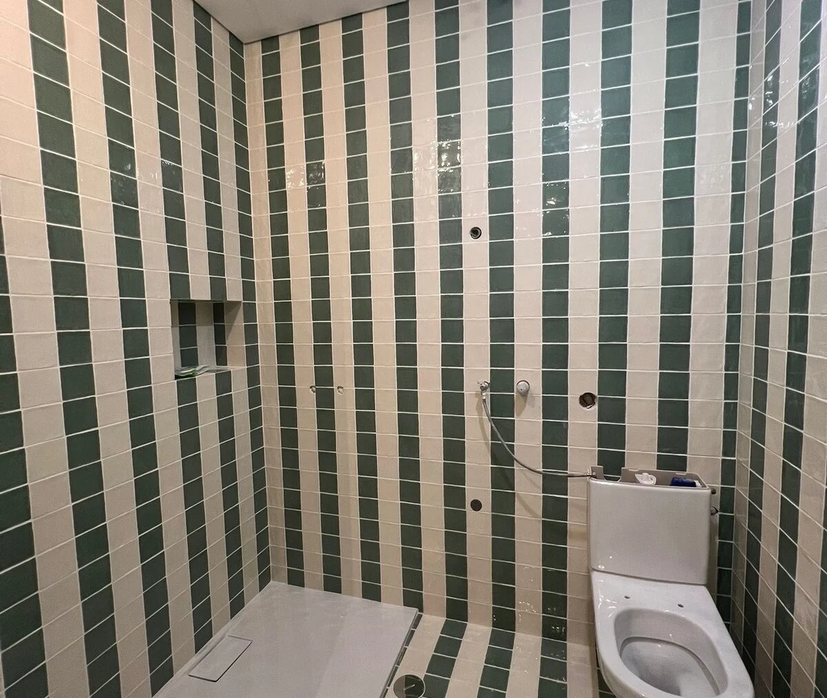 Shower in striped tile, finished