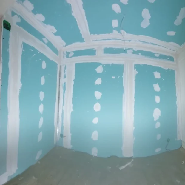 Partition in moisture-resistant board, joints taped