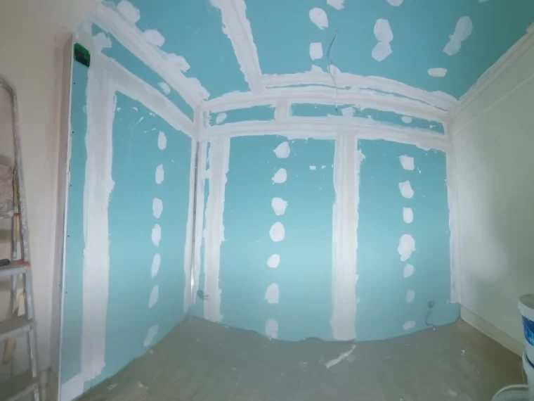 Partition in moisture-resistant board, joints taped
