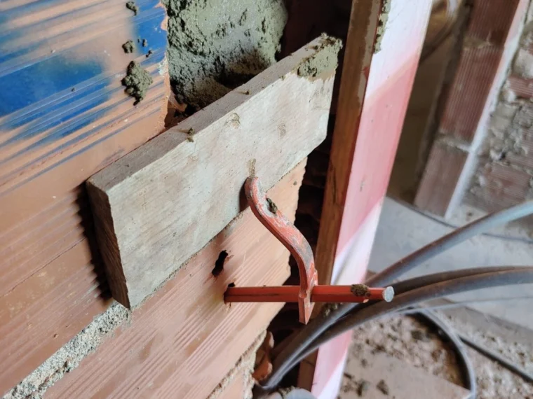 Cutting and running pipework through a brick wall