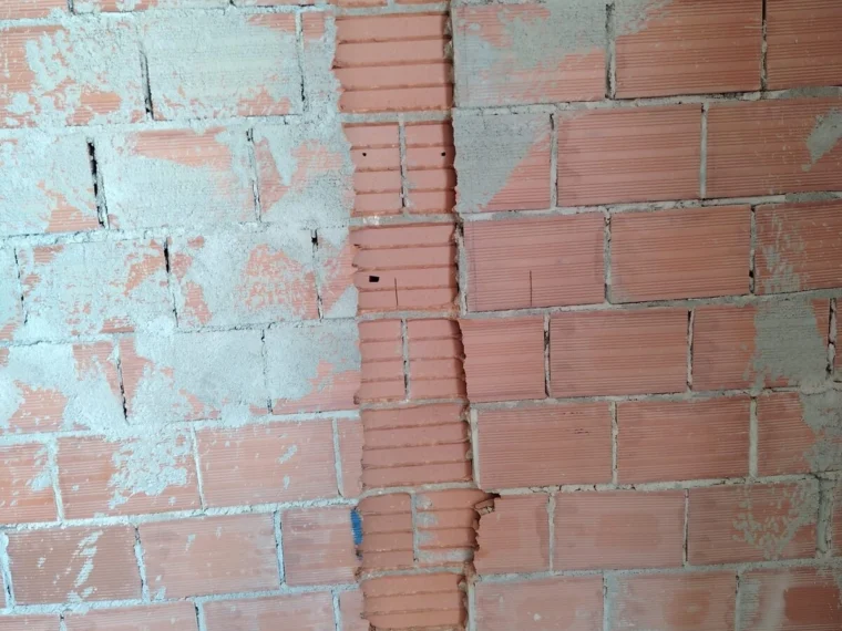 Vertical chase in a brick wall, made good